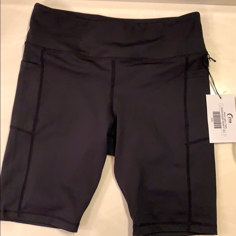 Zyia black light n tight pocket hustle shorts 8”
